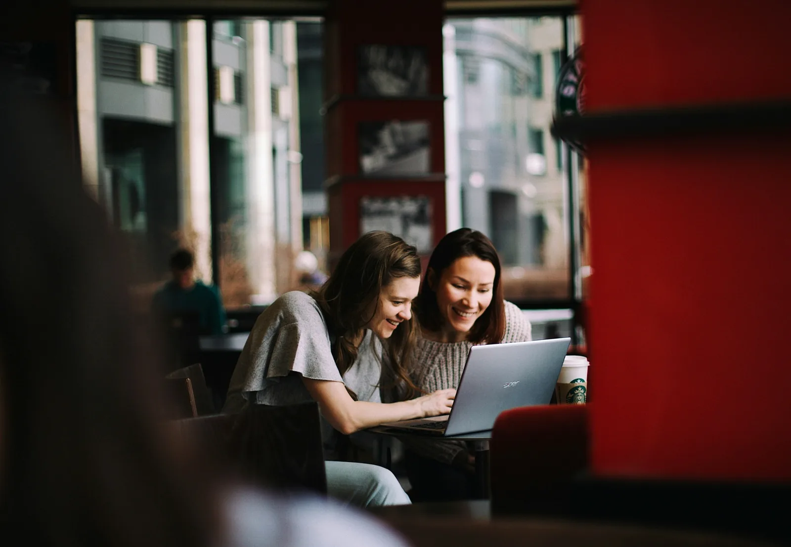 Two women looking at a laptop together